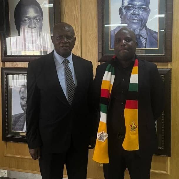 Ndaba Chiwara with a delegate at an official engagement